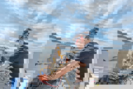 technician inspecting the outdoor units