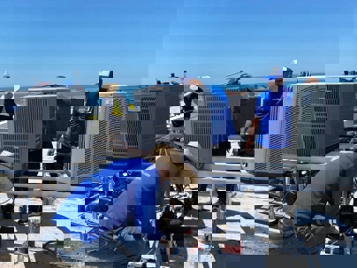 technicians checking the outdoor units