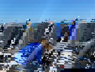 technicians checking the outdoor units