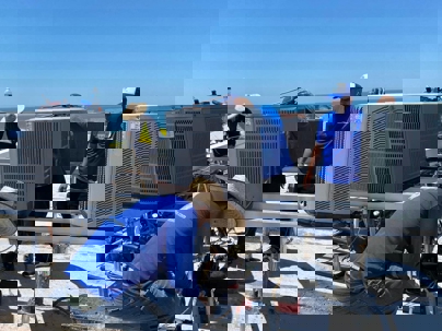 technicians checking the outdoor units