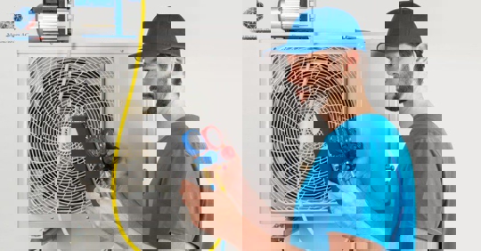 Technician checking an HVAC unit.