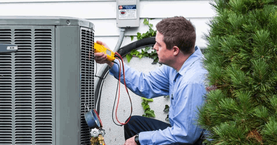 Technician checking an HVAC unit.